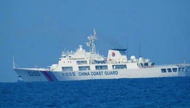 This April 13, 2021 photo released by the Philippine Coast Guard shows China Coast Guard ship with bow number 5203 in the West Philippine Sea.