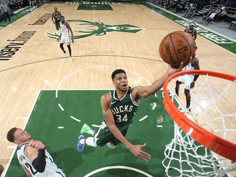Antetokounmpo powers Bucks over Nets in NBA return