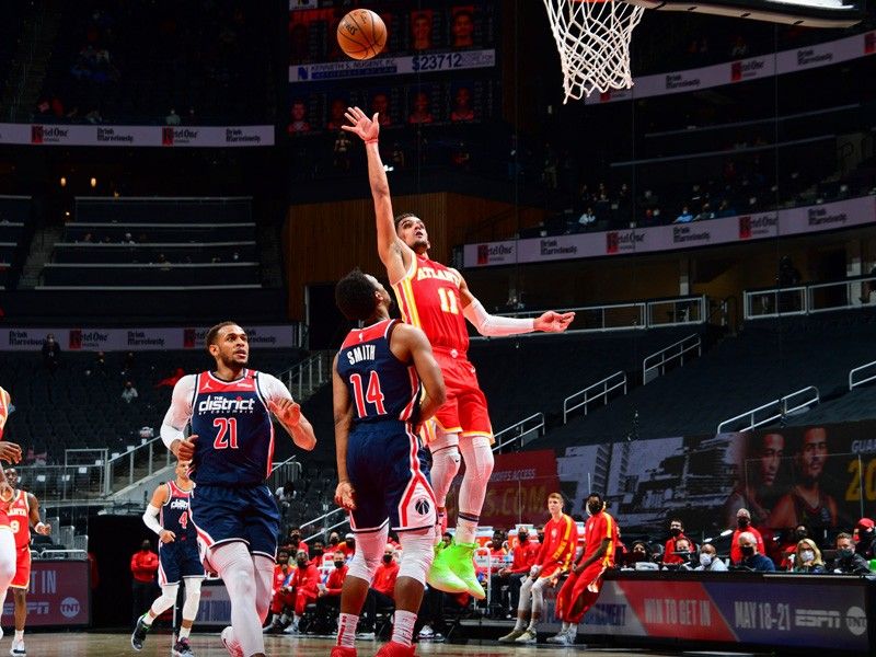 Hawks rally to beat Wizards, clinch NBA playoff berth