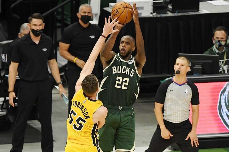 Middleton lifts Bucks over Heat in OT, Mavs down Clippers in playoff openers