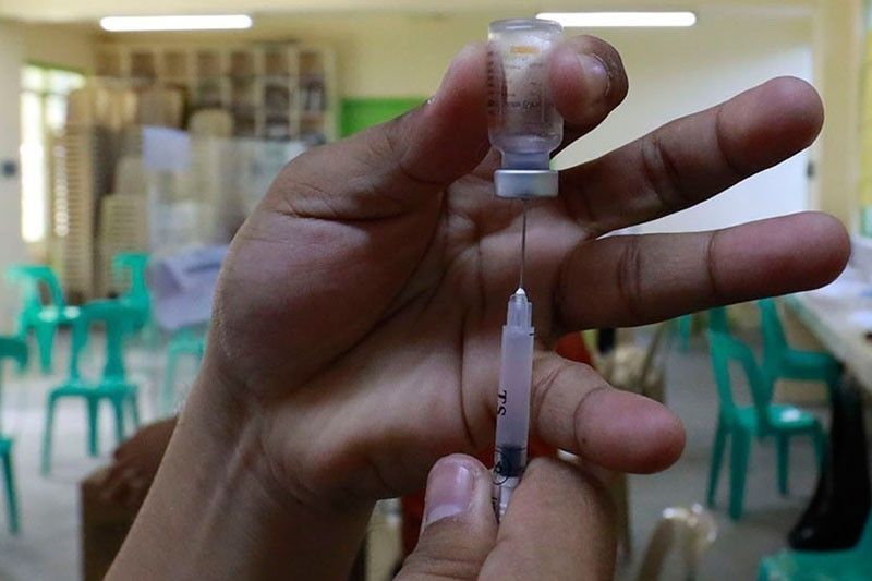 Outbound OFWs, health workers' families now in top vaccination priority group