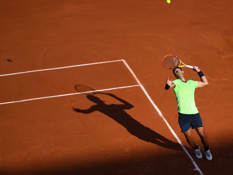 Blinded by the light as Nadal reaches 15th French Open quarterfinal