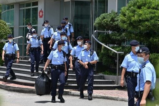 Hong Kong police raid pro-democracy newspaper, arrest five