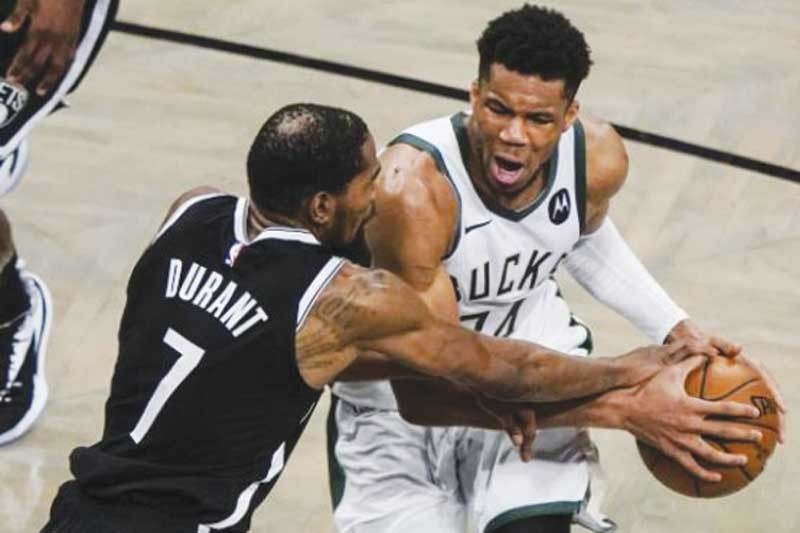 Bucks tinakasan ang Nets sa OT