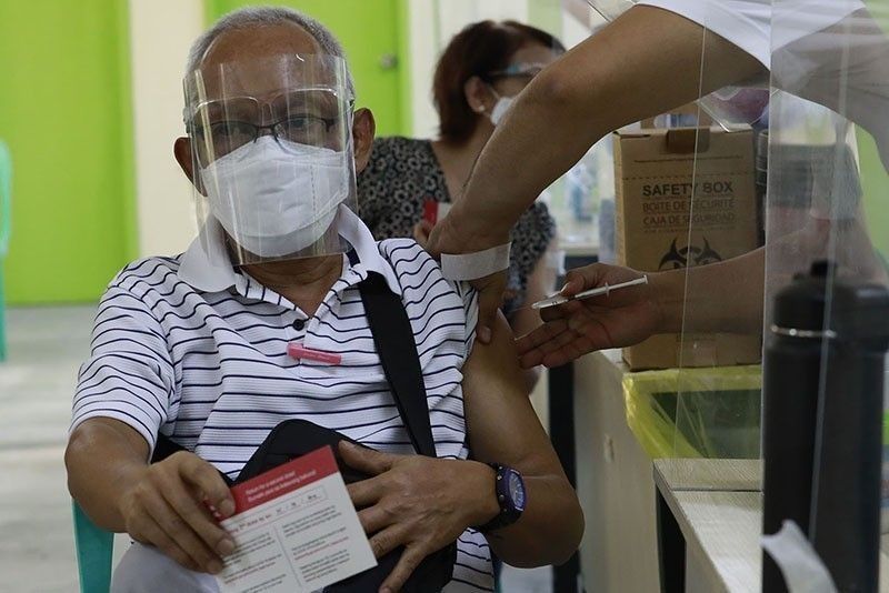Quezon City uses security seals on vaccination cards