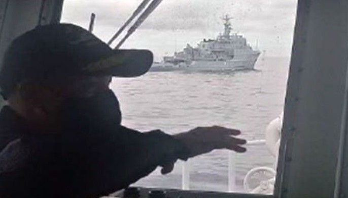 Coast Guard challenges, follows Chinese warship out of West Philippine Sea