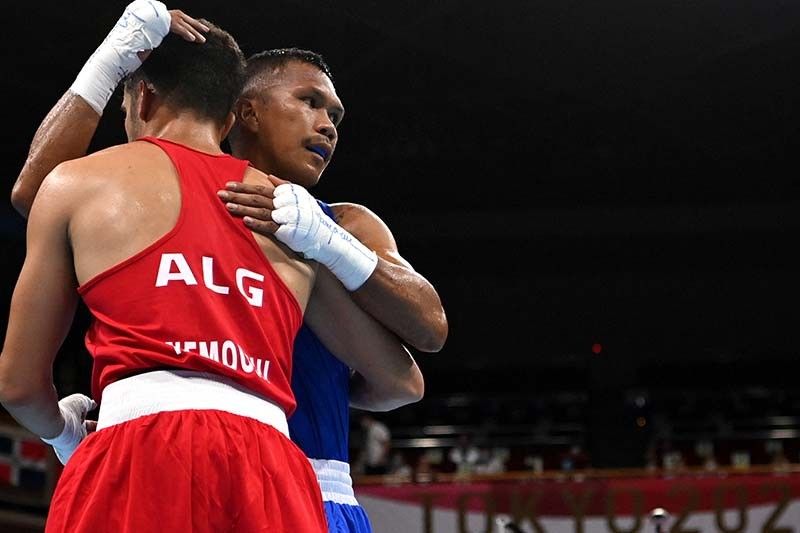 Marcial pulls off rousing Olympic debut with stoppage win over Algerian foe