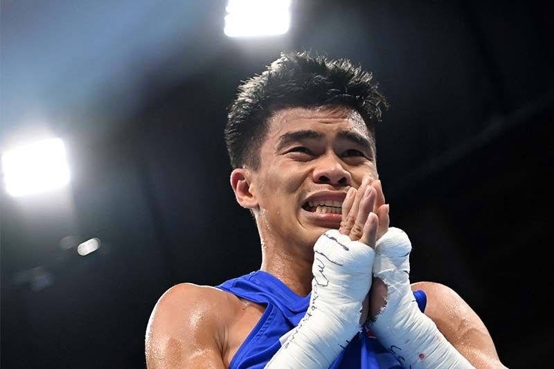 Goodbye reigning champ, hello another Olympic medal: Paalam beats Uzbek to enter boxing semis