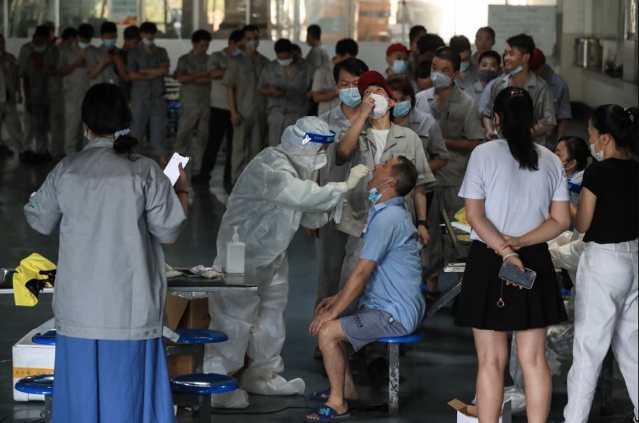 China restricts overseas travel to curb COVID outbreak