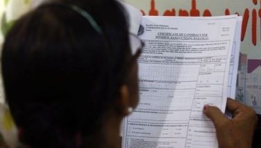 Undated file photo shows an electoral aspirant filling up a certificate of candidacy at the Commission on Elections.