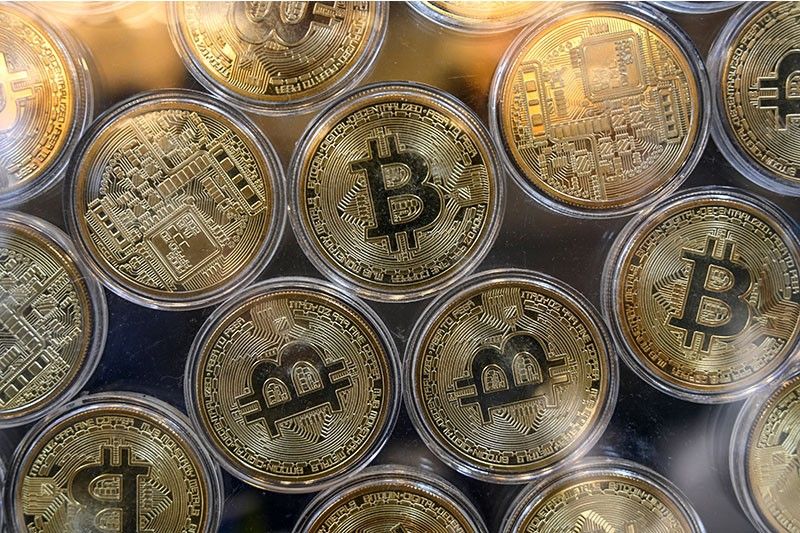 Bitcoin hits new record above $65,000 after Wall Street foray