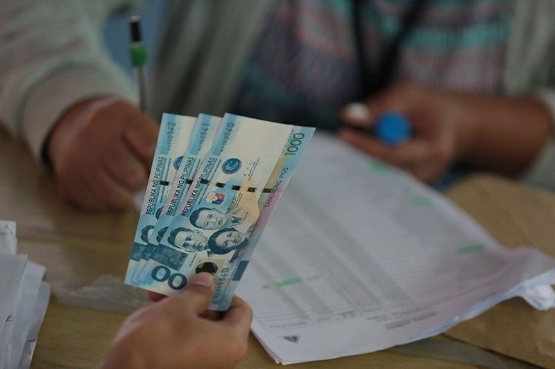 DOLE adopts new rules on cash aid distribution