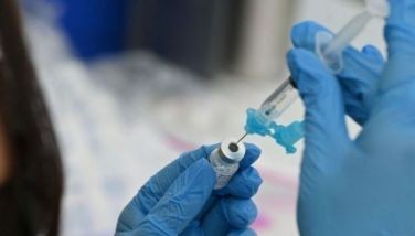 In this file photo a healthcare worker fills a syringe with Pfizer COVID-19 vaccine at a community vaccination event in Los Angeles, California, August 11, 2021.
