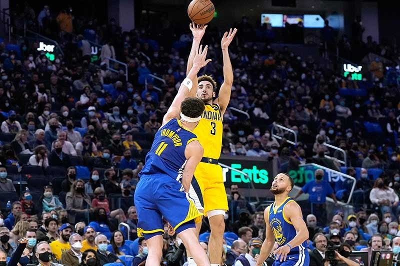 Undermanned Pacers stun cold-shooting Warriors in OT