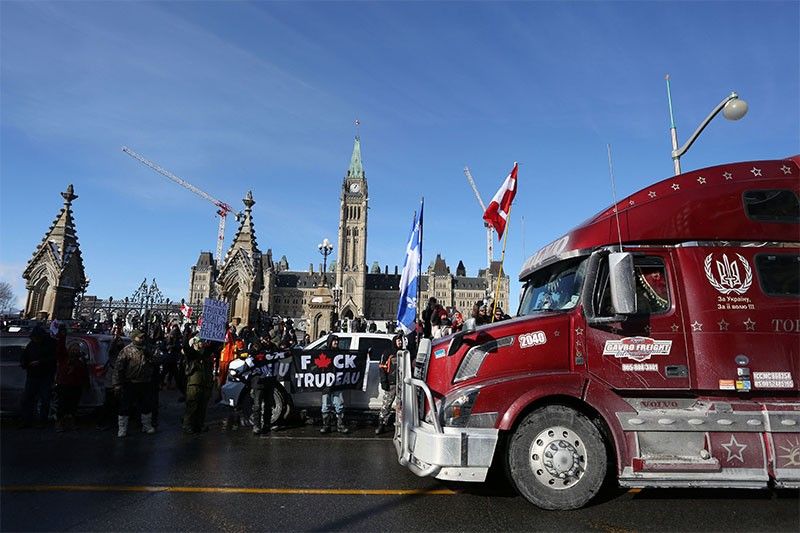 Hundreds of truckers pour into Ottawa to protest vaccine requirements