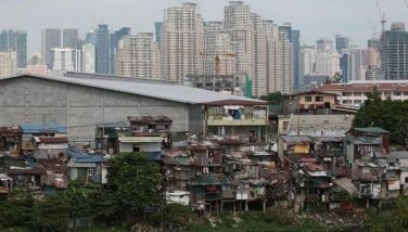 Ortigas Business district dwarfs slum area in Pasig Floodway on May 25, 2020.
