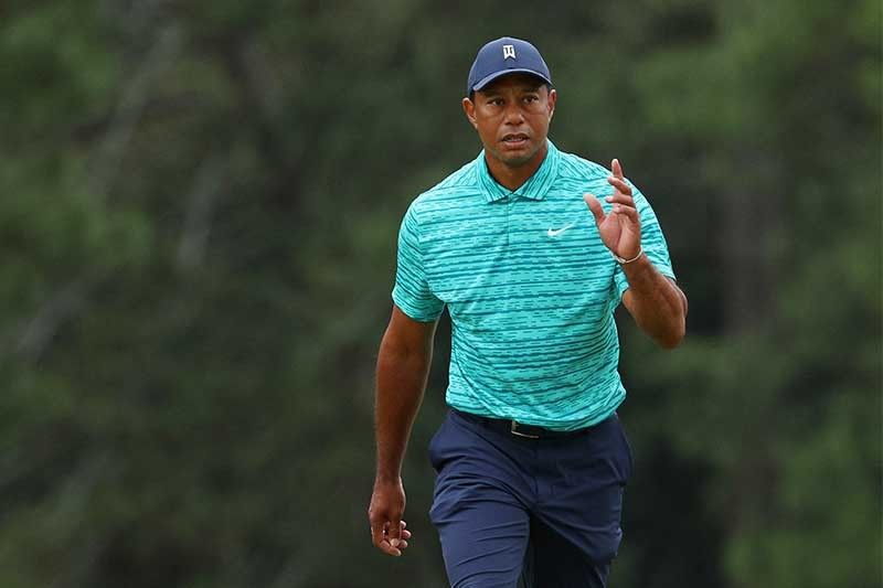 Tiger fights back to stay in the hunt at the Masters