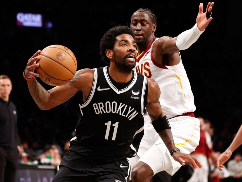 Irving shines as Nets punch playoff ticket over Cavs