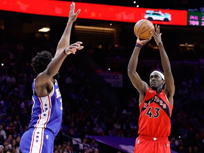 Raptors rout Sixers to stay alive