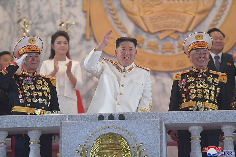 At military parade, Kim vows to boost North Korea nuclear arsenal