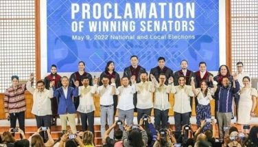 The 12 newly-elected senators raise each other's hands after the proclamation of winners of the 2022 polls at the Philippine International Convention Center in Pasay City on May 18, 2022.