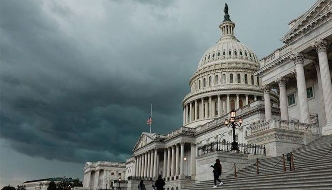 A storm cloud hangs over the U.S. Capitol Building on May 16, 2022 in Washington, DC. This week the U.S. Senate is expected to take up a vote on a $40 billion package of military and humanitarian aid to Ukraine.