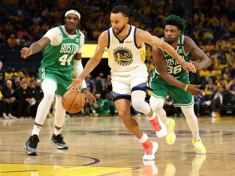 Curry stars as Warriors down Celtics to tie NBA Finals series