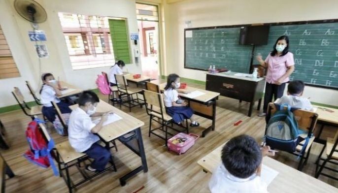 A teacher guides her pupils with their tasks as face-to-face classes resume at St. Mary Elementary school in Marikina City on June 20, 2022, Monday. 