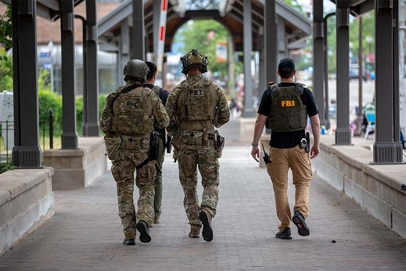 Police arrest suspect after gunman kills six at US July 4 parade