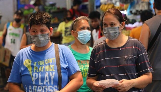 People wearing face masks as protection against the COVID-19 while inside the market in Marikina City.
