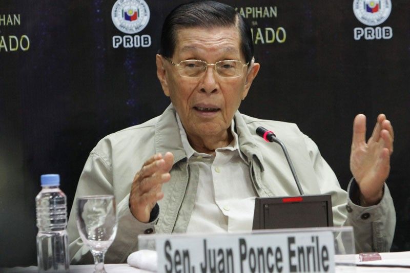 Marcos swears in Enrile as chief legal counsel