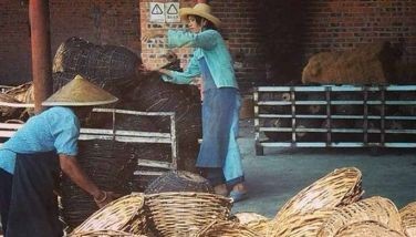 Villagers in a factory outside Nanning in Guangxi province stack baskets that are exported and sold in department stores in the US.