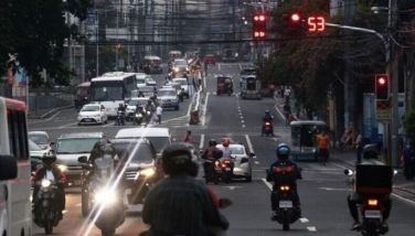 Motorists drive through various intersections in Cubao, Quezon City on Tuesday, Aug. 2, 2022. The Metro Manila Development Authority is set to upgrade the traffic control system in Metro Manila that operates based on an intersection's volume of vehicles.