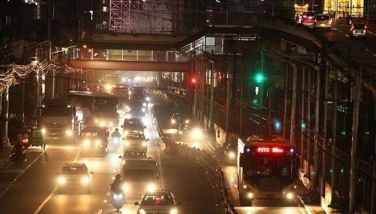 Motorists ply the northbound lane of EDSA in Pasay City before dawn on Aug. 14, 2022. The Metropolitan Manila Development Authority (MMDA) will reimplement their number coding scheme in the morning, from 7 a.m. to 10 a.m., starting August 15 to help decongest traffic along EDSA during rush hour. 