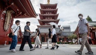 People visit Sensoji Temple, a popular tourist location, in Tokyo on Sept. 13, 2022.