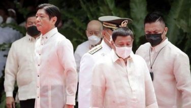 Incoming Philippine President Ferdinand Marcos Jr (L) and outgoing President Rodrigo Duterte (C) take part in the inauguration ceremony for Marcos at the Malacanang presidential palace grounds in Manila on June 30, 2022. The son of the Philippines' late dictator Ferdinand Marcos was to be sworn in as president on June 30, completing a decades-long effort to restore the clan to the country's highest office.