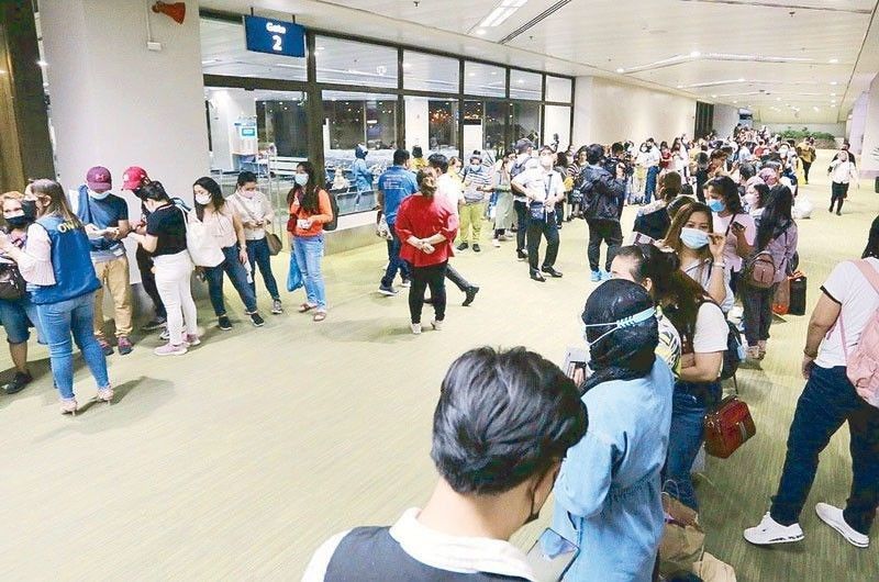 Wearing of PPEs no longer required for traveling OFWs