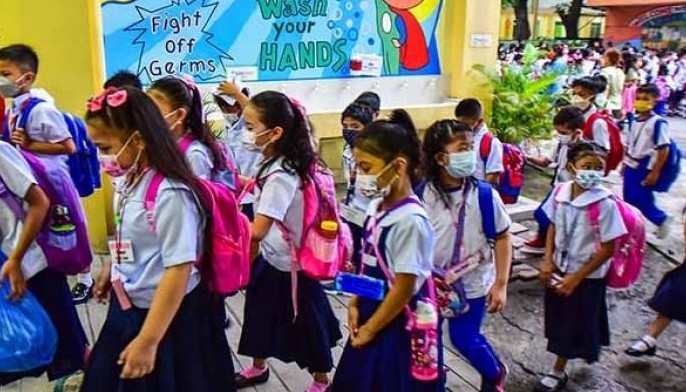 Students attend the first day of in-person classes after years-long Covid-19 lockdowns at Pedro Guevara Elementary School in Manila on August 22, 2022.