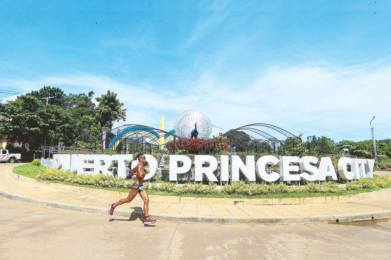 John Alcala, Ling Er Choo win Ironman 70.3 Puerto Princesa