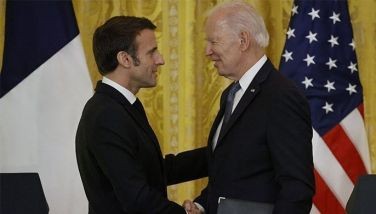 US President Joe Biden and French President Emmanuel Macron shake hands after a joint press conference in the East Room of the White House in Washington, DC, on December 1, 2022. 