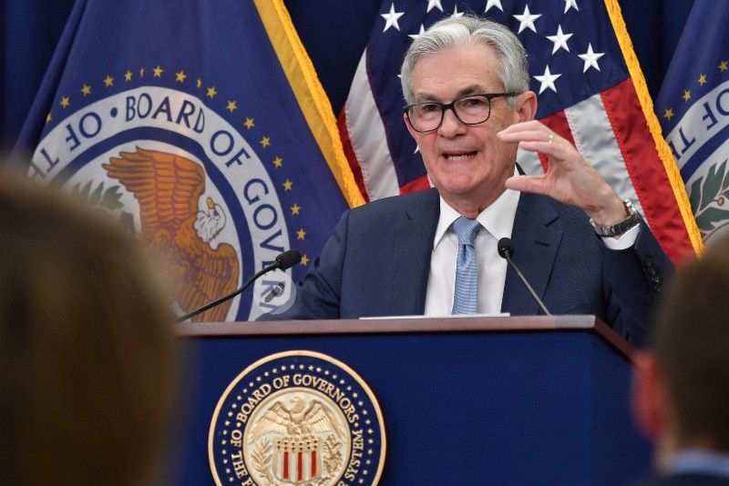Fed pauses interest rate hikes but signals more tightening ahead