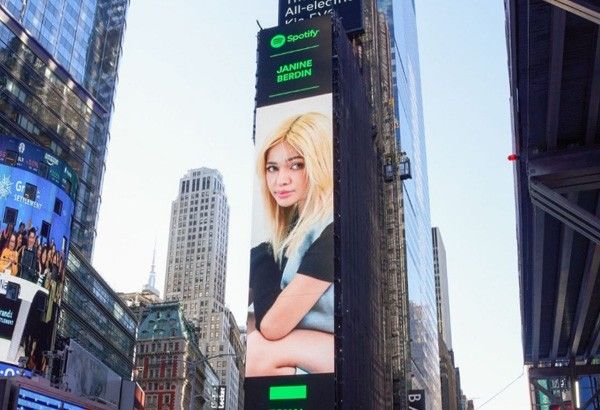 Janine Berdin featured in New York Times Square billboard