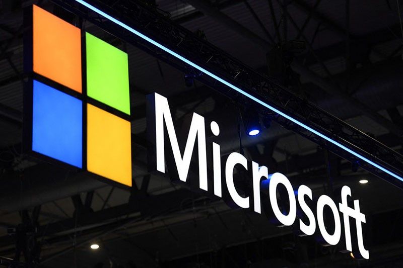 Microsoft briefly overtakes Apple as world's most valuable firm