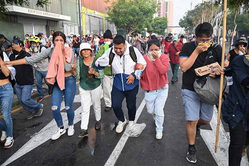 Thousands march in Peru capital to demand president step down