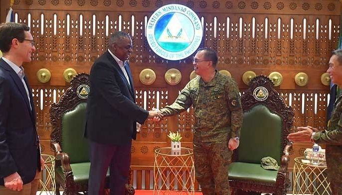 This handout photo taken on February 1, 2023 and released by Western Mindanao Command (WESTMINCOM) shows US Secretary of Defense Lloyd Austin (center L) shaking hands with Philippine military chief General Andres Centino (center R) during a visit to the Westmincom headquarters in Zamboanga City, in southern island of Mindanao. 