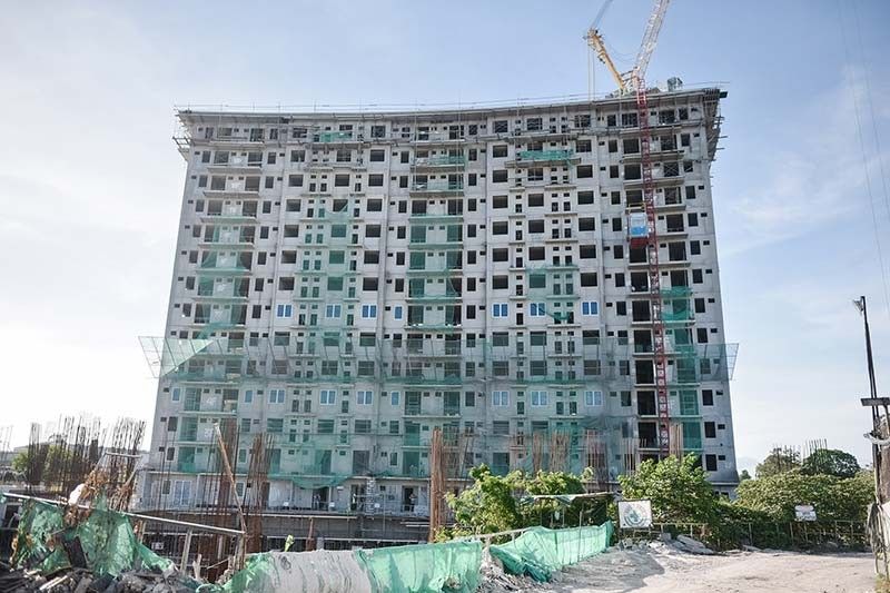ISOC Landâs maiden residential condo development tops off