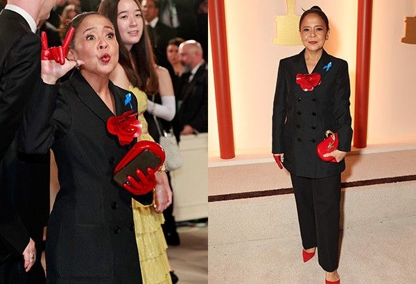 Dolly de Leon mengenakan pita untuk pengungsi di karpet merah Oscar 2023