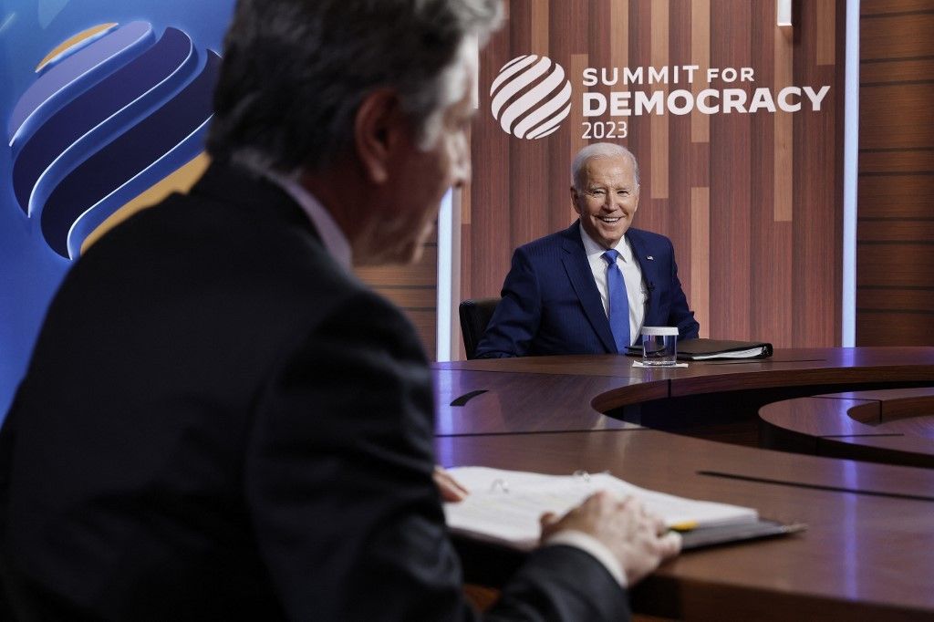 Biden, seeing 'turning point' for democracy, offers funding push at summit