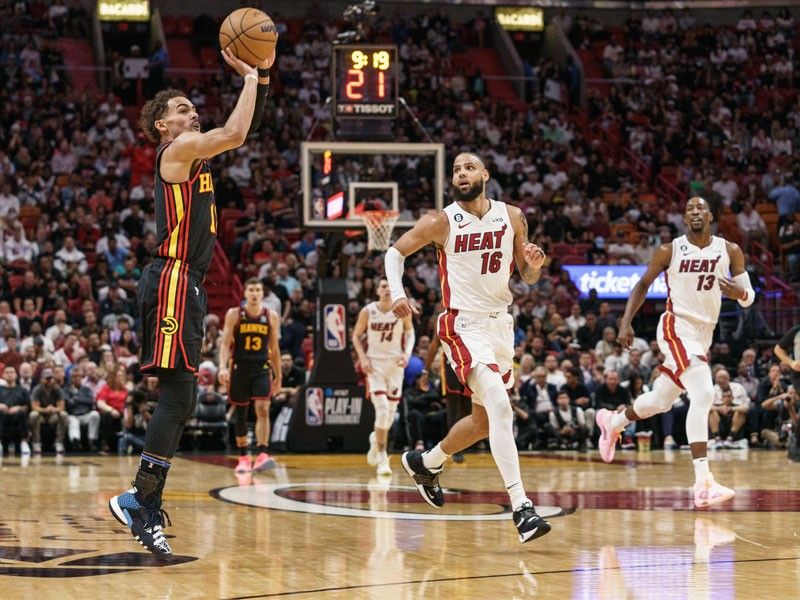 Hawks cool down Heat to book NBA playoff berth