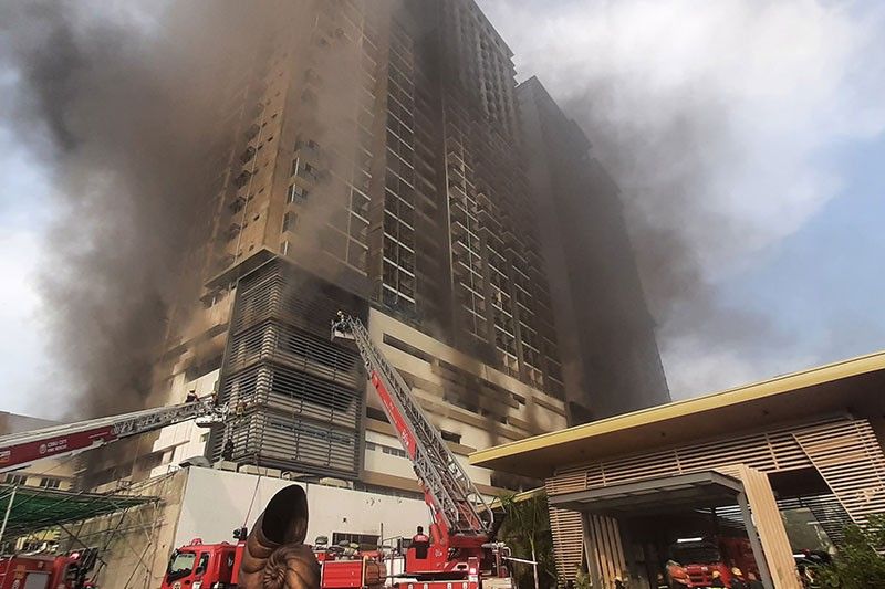 Construction of burned condominium suspended